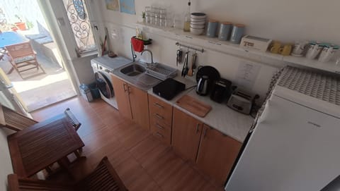 Kitchen ground floor, one table two chairs, no stove/ dish washer, fridge shared