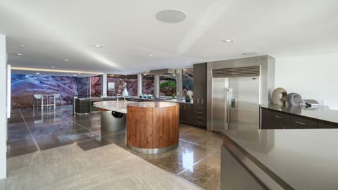 Full kitchen flowing to the activity center w/ oversized fridge & island