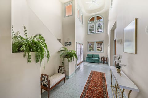 Entrance area: green "Love seat" with pull-out twin mattress sleeper.