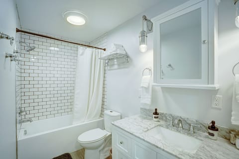 Combined shower/tub, hair dryer, towels, soap