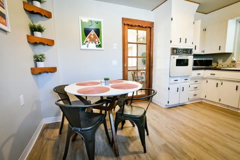 Updated modern vintage 1960s kitchen fully stocked with essential cooking items