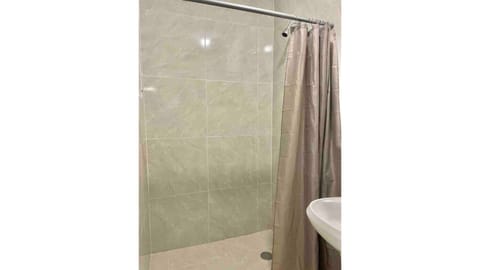 Combined shower/tub, hair dryer, towels, soap