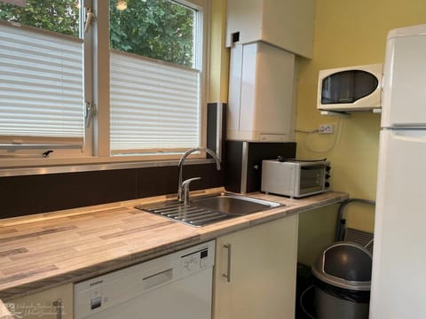 Fridge, dishwasher, coffee/tea maker, dining tables