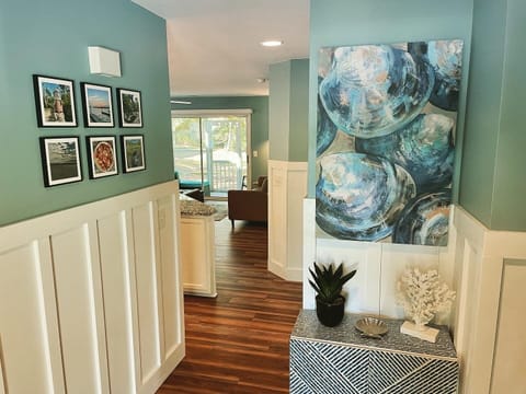 Inviting entryway with local photography & coastal art to greet you.