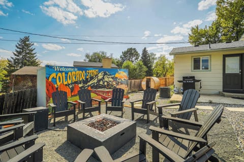 Cozy Fire Pit & Colorful Mural Vibes! Gather around the fire pit for s'mores, stargazing, and great conversations with a vibrant mural setting the perfect backdrop.