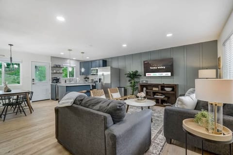 Unwind in Style! This Plush Couch Invites You to Relax. With Bedside Lamps, Enjoy a Cup of Coffee and Catch Your Favorite Shows in Ultimate Comfort.