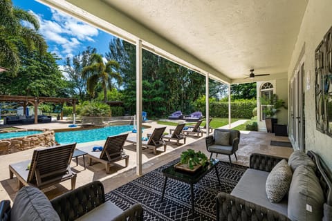 A heated pool, sun loungers