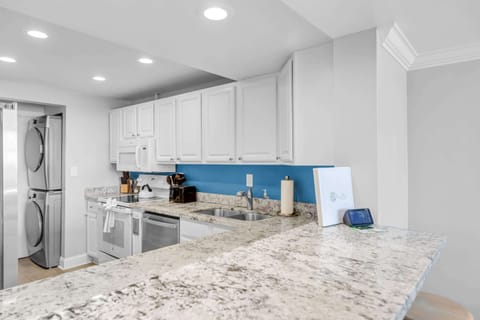 Kitchen with washer/dryer and water views