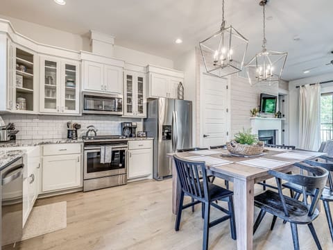 Open concept kitchen, dining and living spaces allows for easy connecting with family or friends.