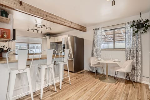 Prepare your favorite meals in the spacious, fully equipped kitchen and serve them on the nearby dining table.