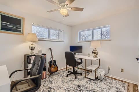 This office comes complete with two desks and two extra monitors for remote workers!