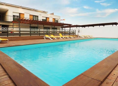 Dive into the outdoor pool on a hot summer day.