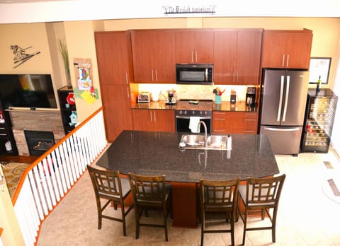 Kitchen with large island and seating for 4.
