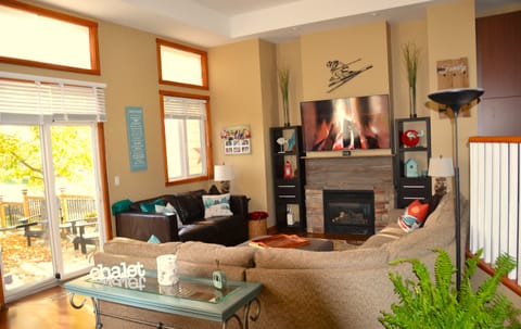 Large living room is comfortable and cozy with a gas fireplace.  