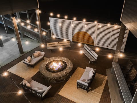 Enjoy the warm glow of our outdoor gas firepit - perfect for any gathering.