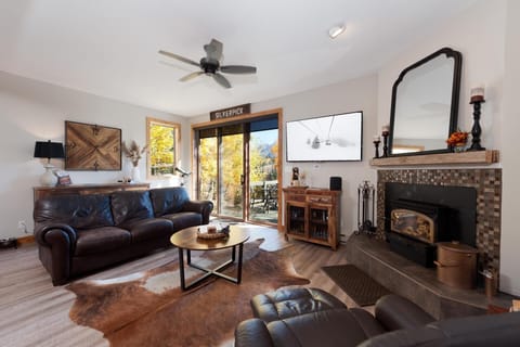 Living Room with Fireplace and Deck