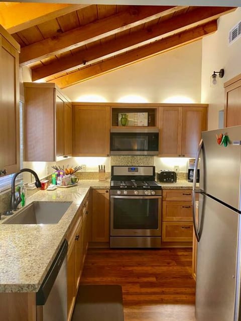 Kitchen is fully equipped with  full sized stove, microwave, dishwasher, and refrigerator. Our home is your home, so feel free to cook your meals with a full array of pots and pans and a fully stocked spice cabinet. Plenty of plates and glassware