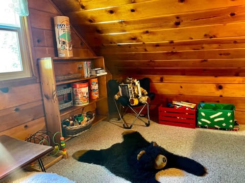 This cute upstairs room comes complete with, Lincoln logs, Duplo, Thomas the train, as well as games for kids.