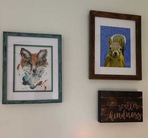 Playful and uplifting wall art featuring a watercolor fox, a curious squirrel, and an inspiring `Scatter Kindness` sign.