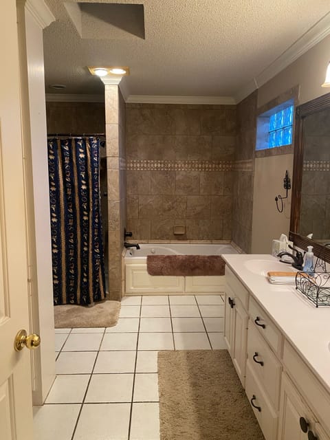 Combined shower/tub, jetted tub