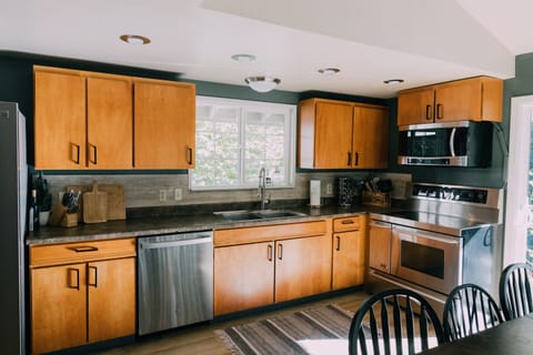 The Skyhouse kitchen is fully stocked with modern appliances.