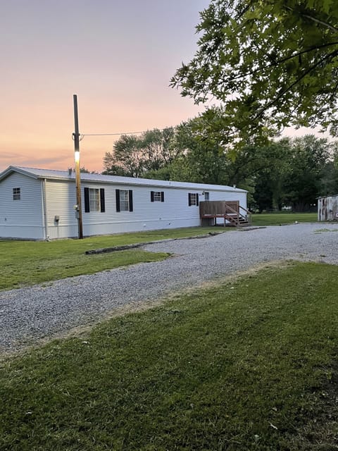 Well lit roomy parking driving into property.