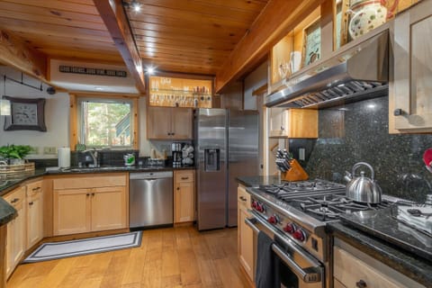 Kitchen includes a coffee bar and Wolf range