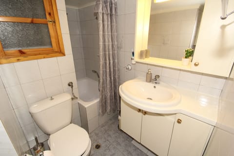 Combined shower/tub, hair dryer, towels, toilet paper