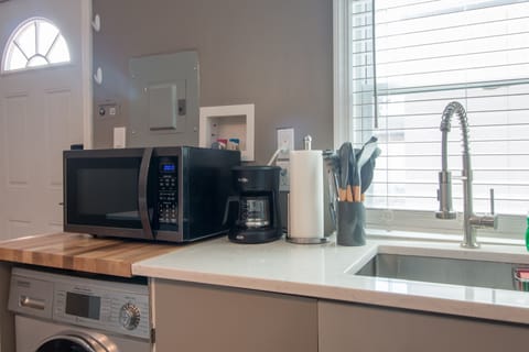 Fridge, microwave, stovetop, coffee/tea maker