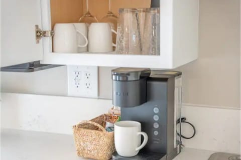 Fridge, microwave, coffee/tea maker, cookware/dishes/utensils