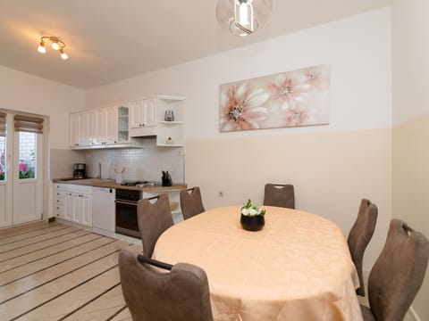 Table, Furniture, Property, Cabinetry, Countertop, Chair, Interior Design, Plant, Lighting, Wood