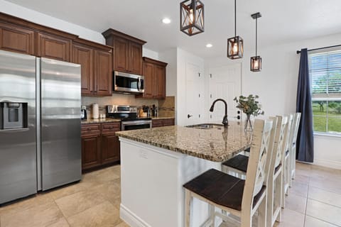 View showing the stainless steel appliances in the kitchen.