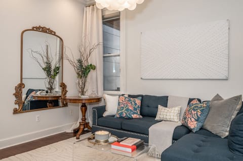 The open concept family & dining room are adjacent to a modern kitchen, and features a private outdoor patio