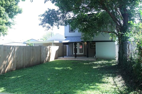 Large private backyard with dining area on the covered patio and BBQ. Great space to hang with family and friends
