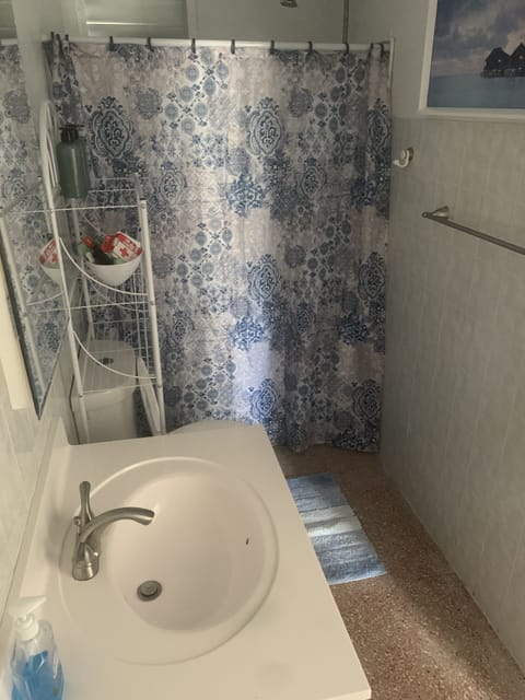 Bathtub, towels, soap, toilet paper