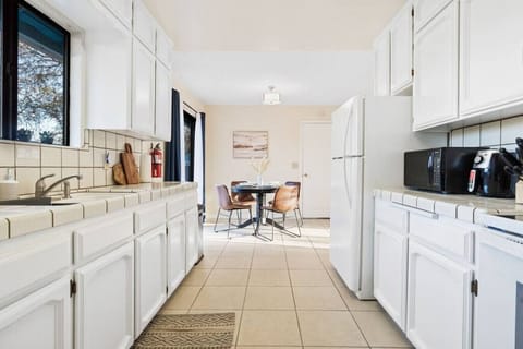 The kitchen includes a fill fridge and microwave and airfryer.