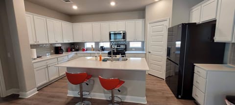 Fully equipped kitchen for meal preparations.