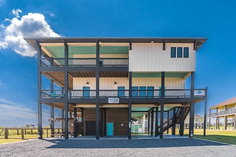 Street side view, beach to the left.