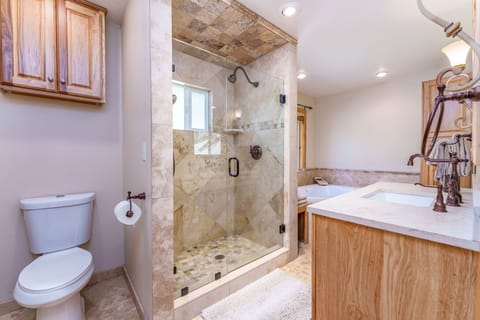 Bathroom 2 with dual-headed walk-in shower and jetted tub