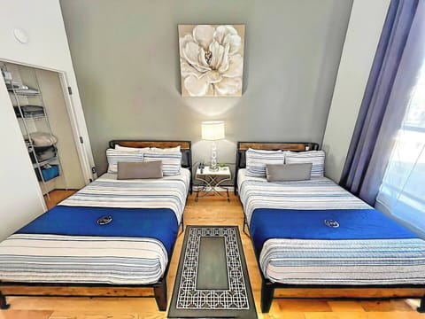 BEDROOM No. 1: Includes (2) Full beds with all pillows, linens and blankets as well as a 50 inch ROKU Smart TV