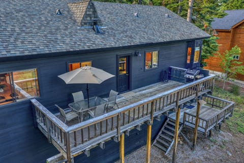 Deck (upper level): 4-person outdoor dining set, gas grill, forest views: