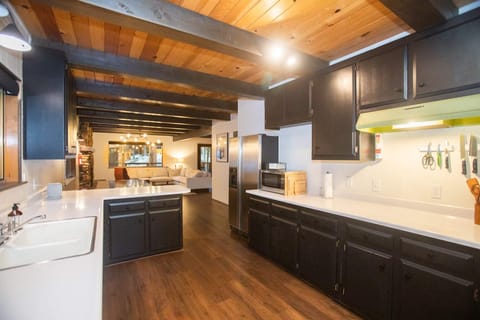 The fully equipped kitchen features modern appliances, ample counter and cabinet space, and all the cookware needed to prepare a delicious meal for your group.