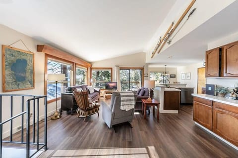 The upper floor features an open-layout living/kitchen/dining room providing an ideal space for relaxing with your group.