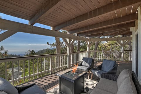 Enjoy the fire pit and swinging hammock chairs while gazing for miles