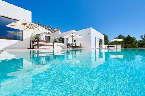 An infinity pool, sun loungers