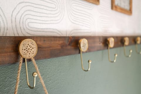 When you walk through our front door, you'll enter into a hallway with hooks for your belongings.