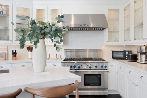 Top-of-the-line stainless steel appliances makes cooking a dream in the open kitchen