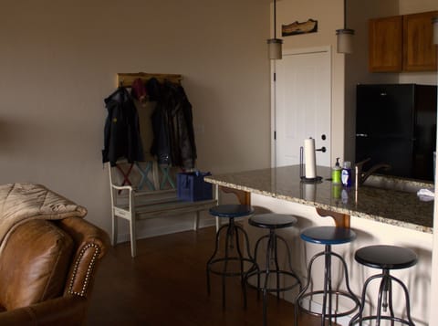 Barstools for extra seating and coat rack and bench for all your gear