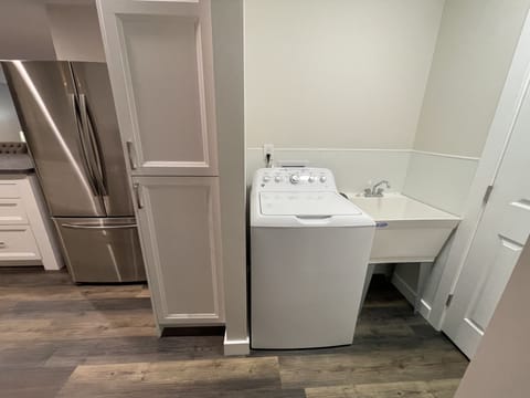 New washing machine, with detergent provided.  