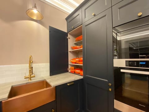 The Kitchen Cupboards include a range of Le Creuset cookware